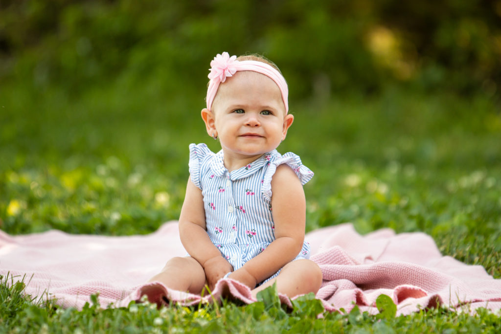 baby on a blanket one year old photo shoot